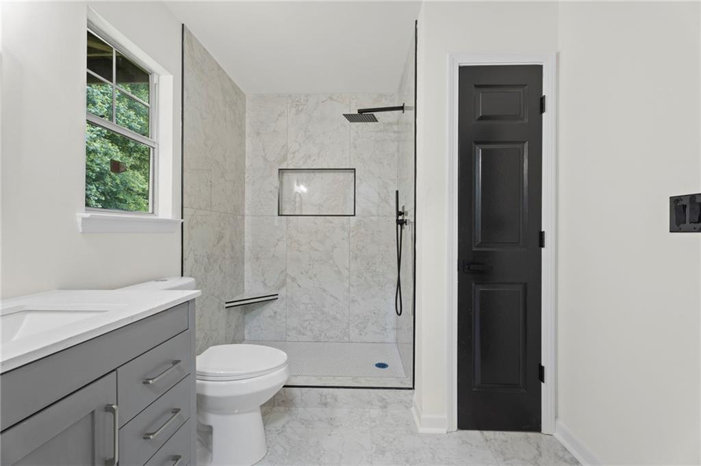 3602 Bristol Overlook Rex, GA 30273 - Photo 30 of 37 a bathroom with a toilet a sink and shower