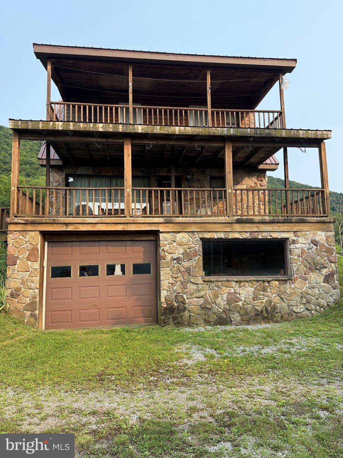 1492 Dice Warner Road Circleville, WV 26804 - Photo 23 of 36 Rustic stone retreat with scenic views.