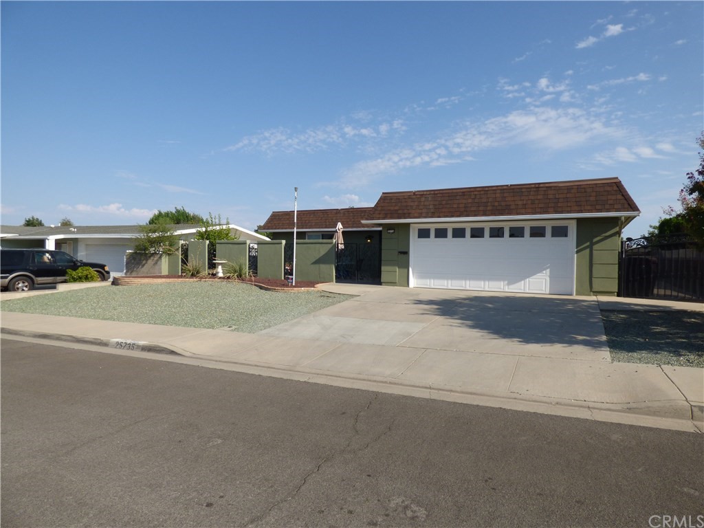 25735 Warwick Road Menifee, CA 92586 - Photo 1 of 1 a front view of a house with a yard