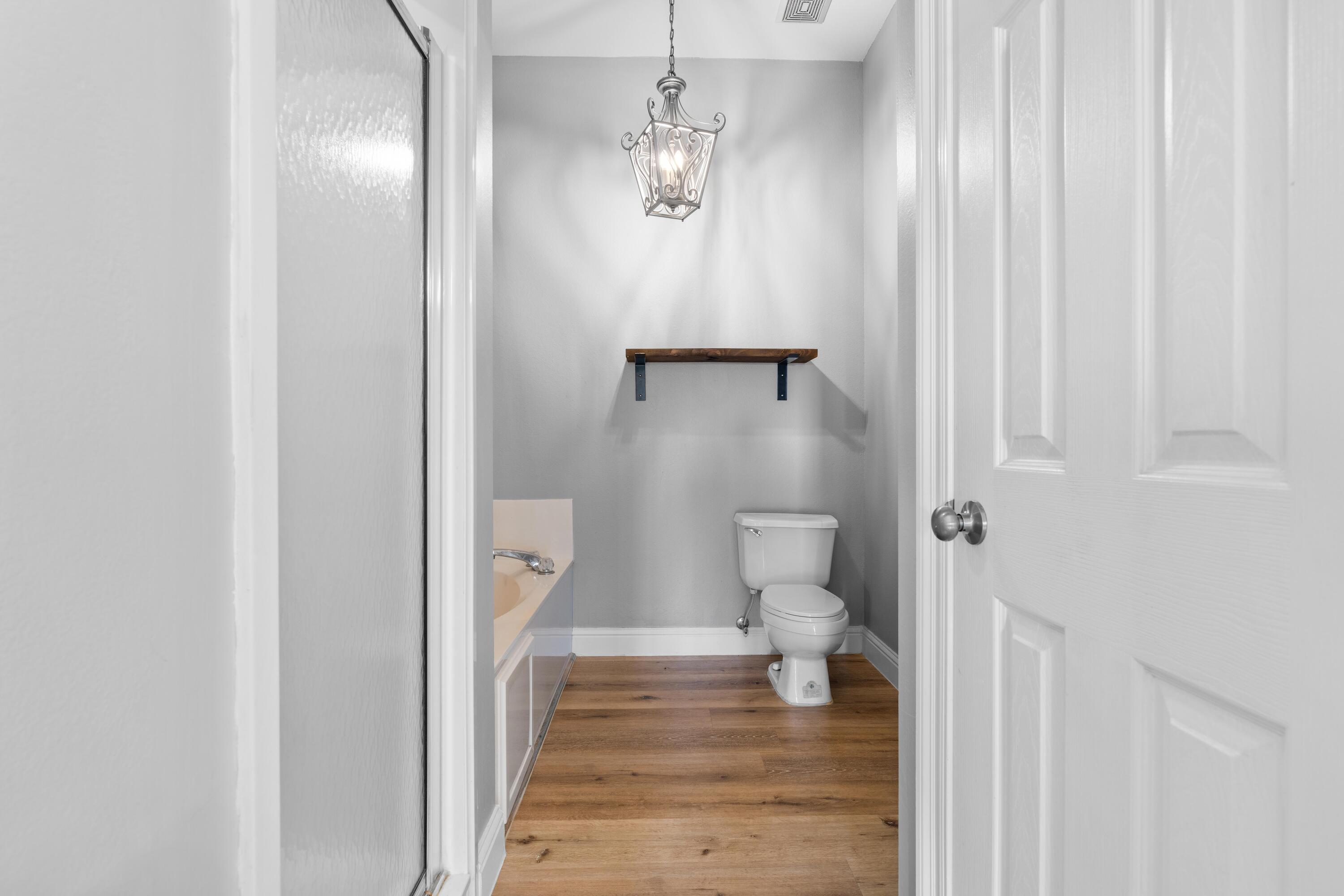 4507 Furling Lane, Unit 302 Destin, FL 32541 - Photo 28 of 49 a bathroom with a sink and toilet