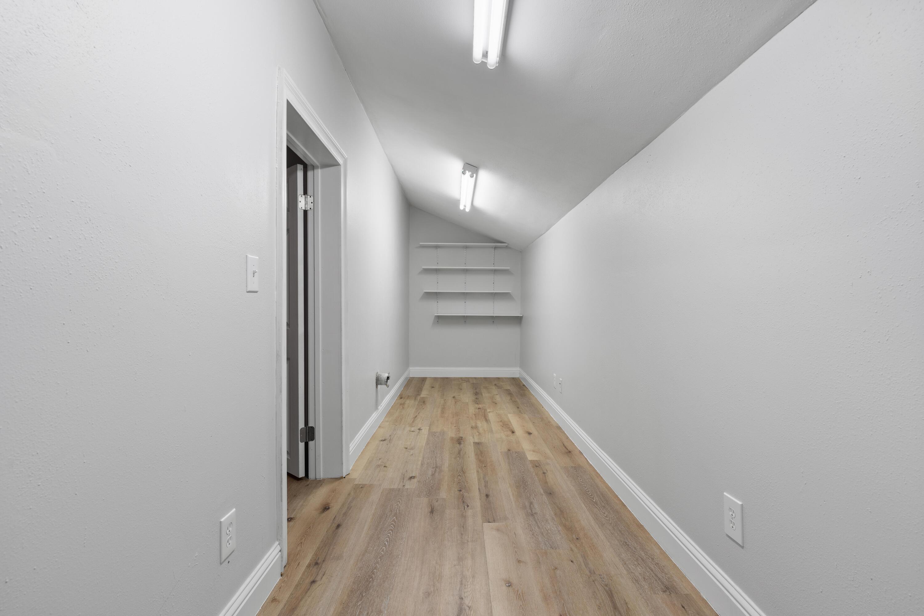 4507 Furling Lane, Unit 302 Destin, FL 32541 - Photo 41 of 49 a view of a room with wooden floor