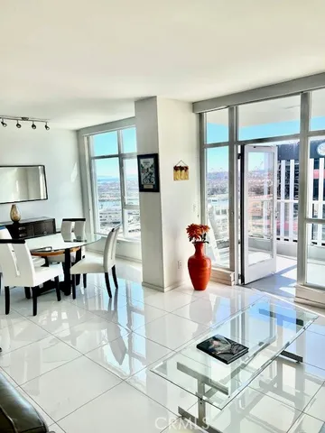 a living room filled with furniture and a table