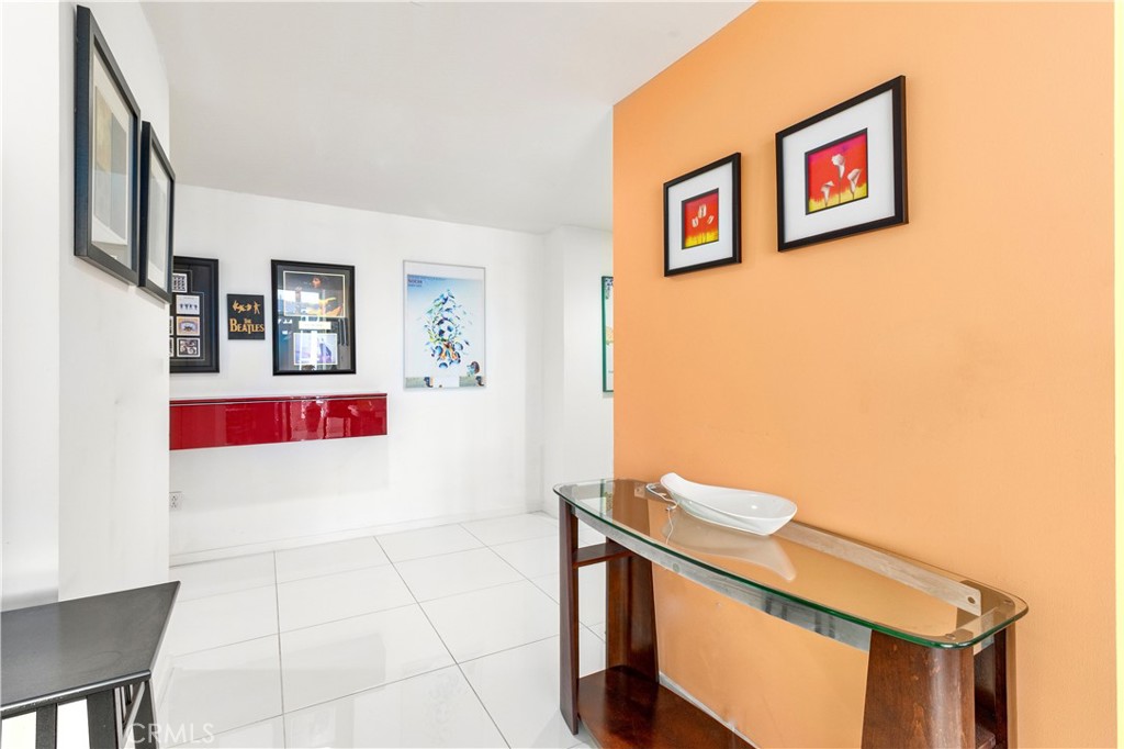 400 West Ocean Boulevard, Unit 2004 Long Beach, CA 90802 - Photo 15 of 47 a view of a hallway with paintings on the wall