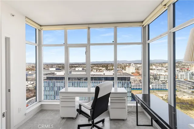 a view of a living room and a balcony