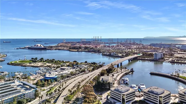 a living room with furniture and a mirror