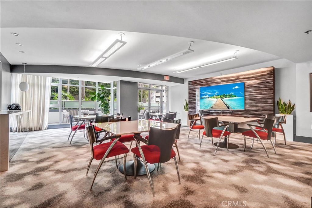 400 West Ocean Boulevard, Unit 2004 Long Beach, CA 90802 - Photo 32 of 47 a view of a dining room with furniture large windows and wooden floor