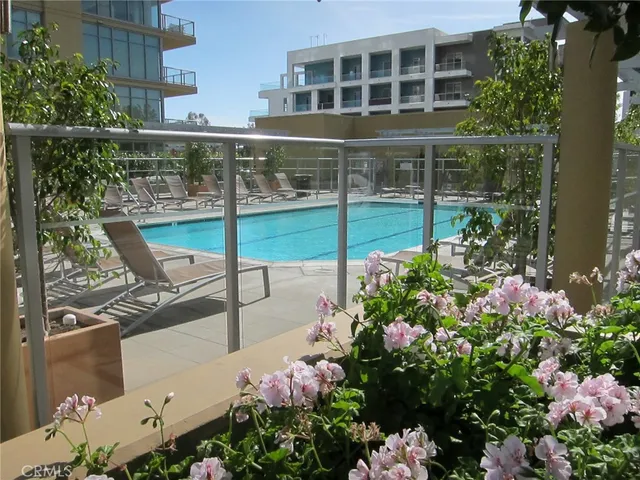 a view of a swimming pool with a lounge chairs