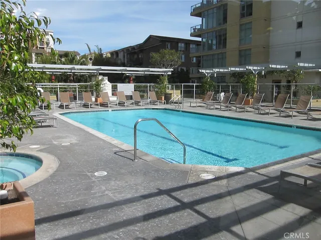 a view of a swimming pool with outdoor seating