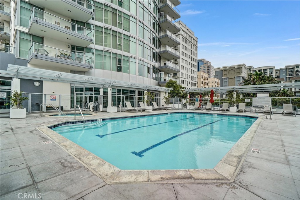 400 West Ocean Boulevard, Unit 2004 Long Beach, CA 90802 - Photo 35 of 47 a view of a swimming pool with a lounge chairs