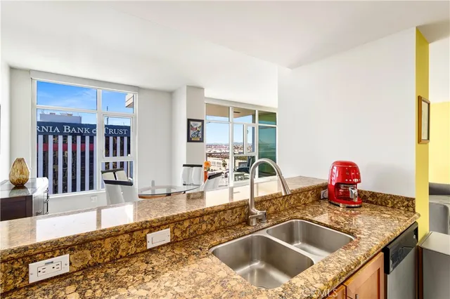 a kitchen with granite countertop a sink and a granite counter top