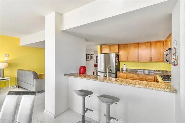 a kitchen with a sink and a refrigerator