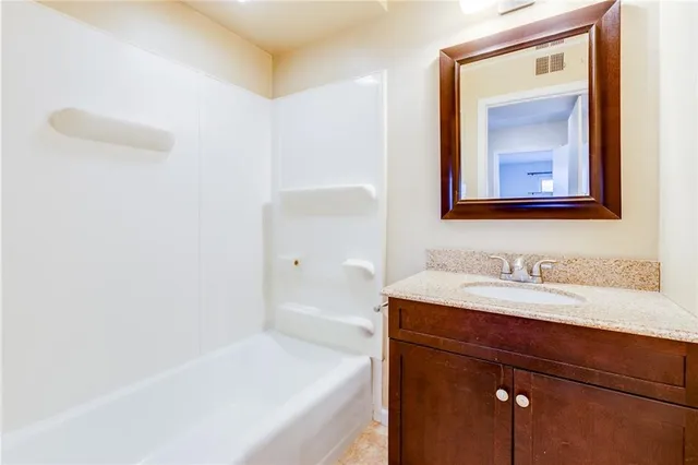 a bathroom with a sink and a bathtub