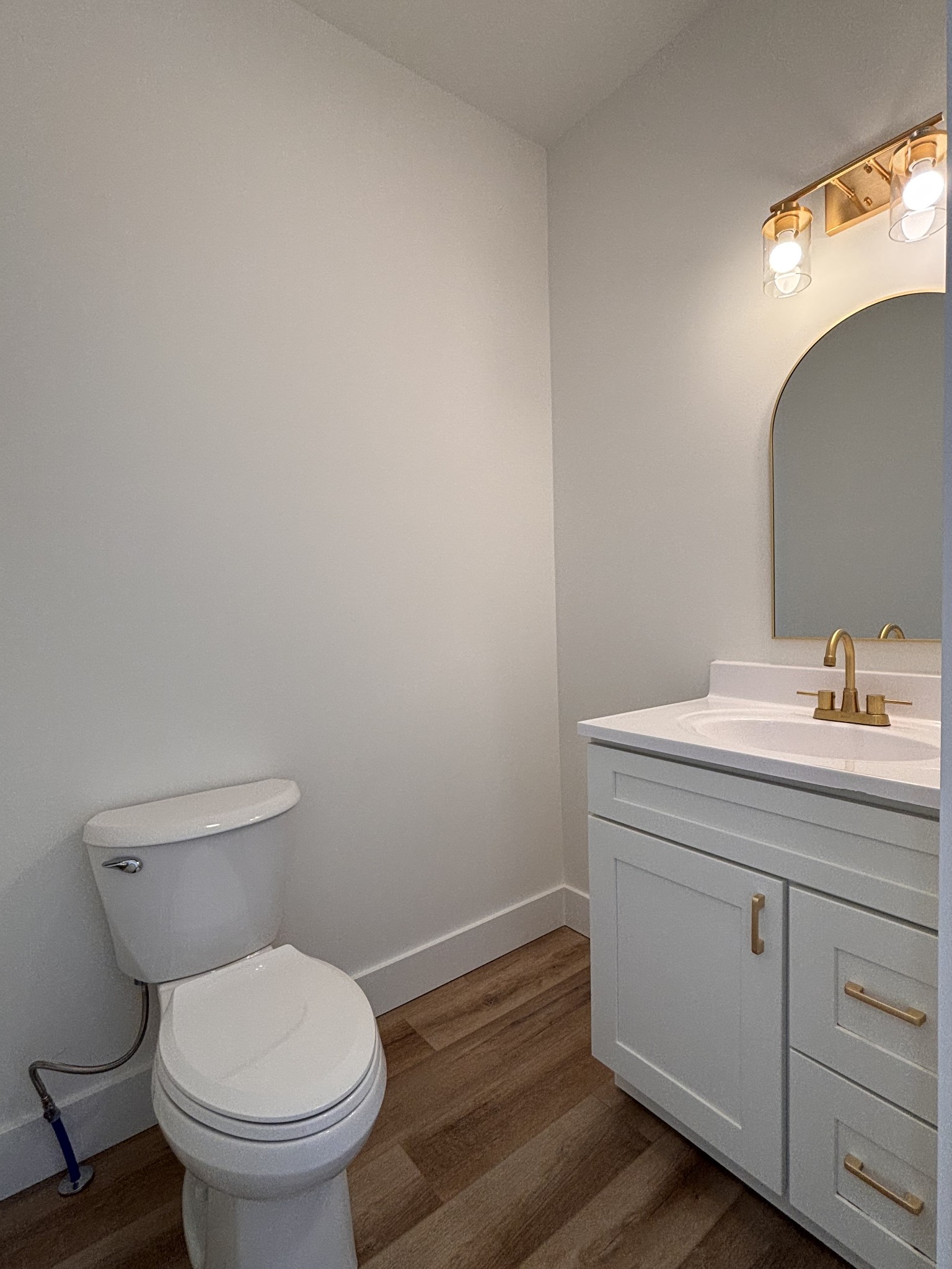 485 Baron Bluff Road Smithville, TN 37166 - Photo 15 of 28 a bathroom with a toilet sink and mirror