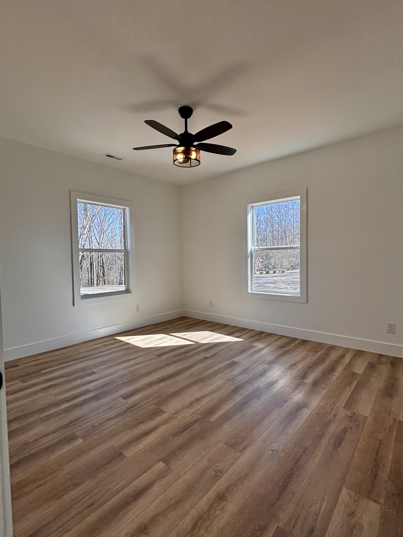 485 Baron Bluff Road Smithville, TN 37166 - Photo 17 of 28 a view of an empty room with window and wooden floor