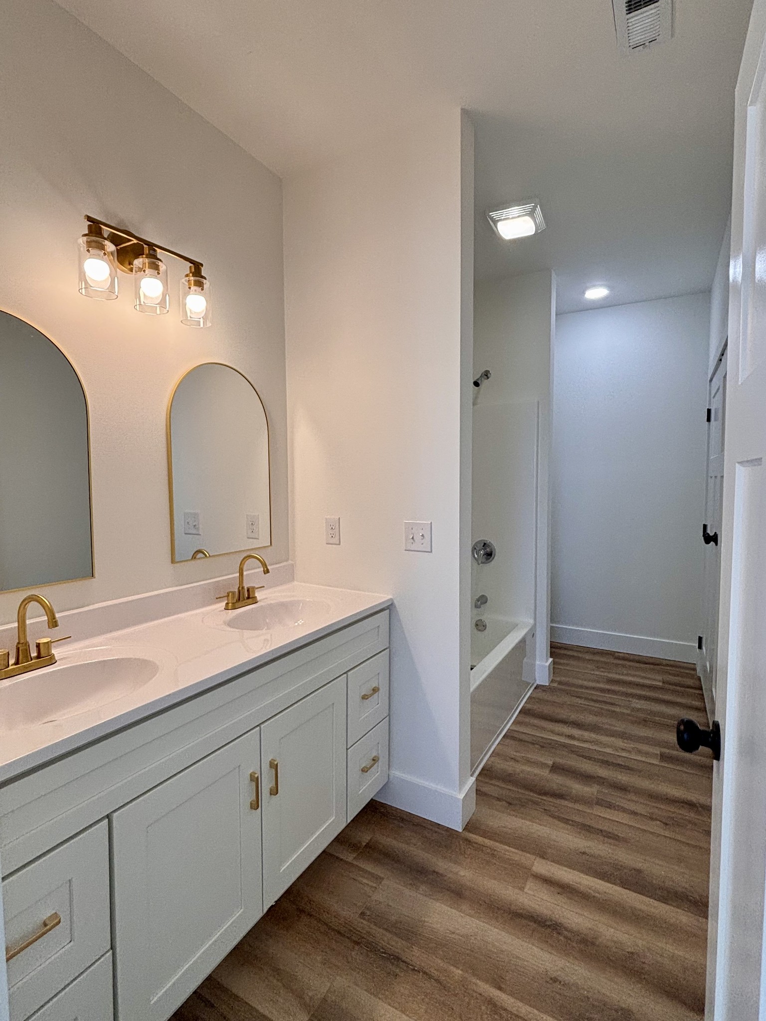 485 Baron Bluff Road Smithville, TN 37166 - Photo 18 of 28 a bathroom with a double vanity sink and mirror