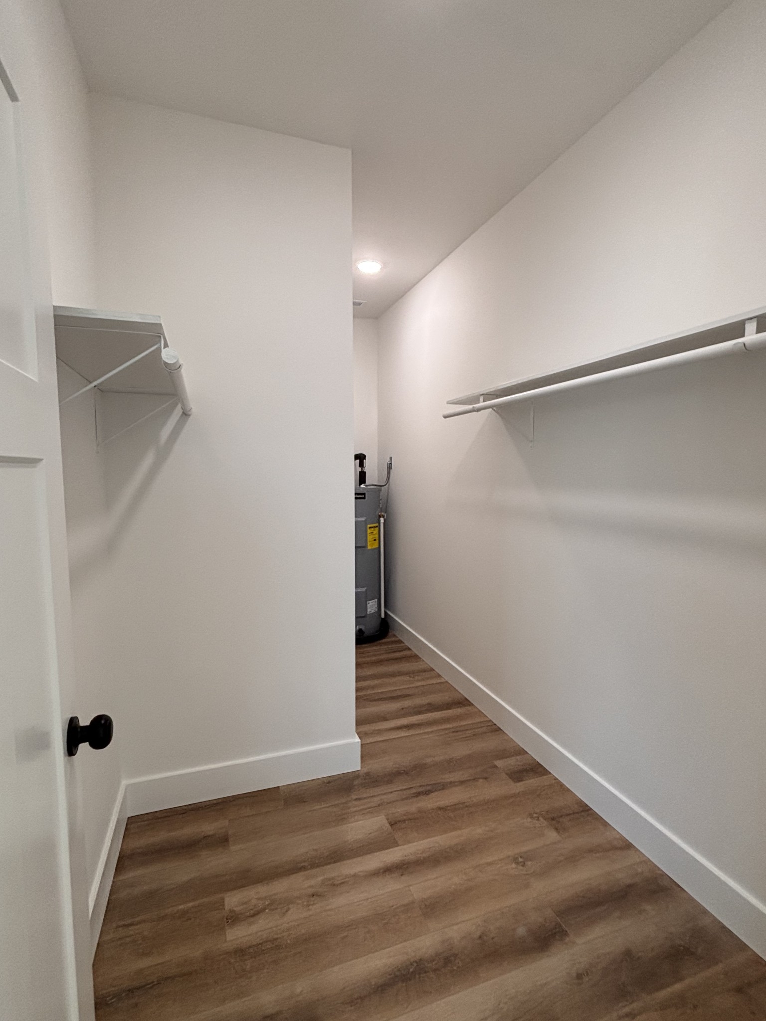 485 Baron Bluff Road Smithville, TN 37166 - Photo 19 of 28 a view of an empty room with wooden floor and a window