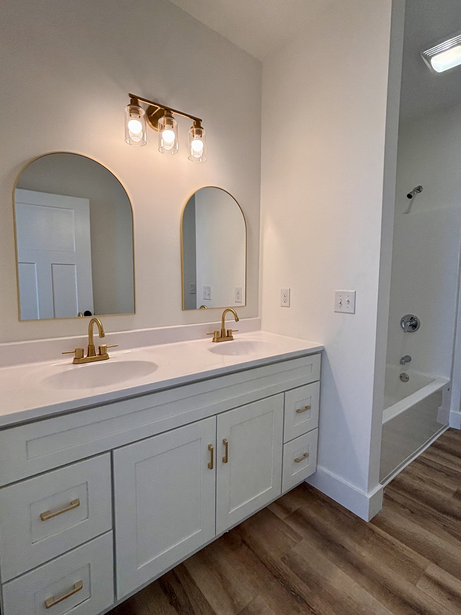 485 Baron Bluff Road Smithville, TN 37166 - Photo 20 of 28 a bathroom with a double vanity sink and mirror