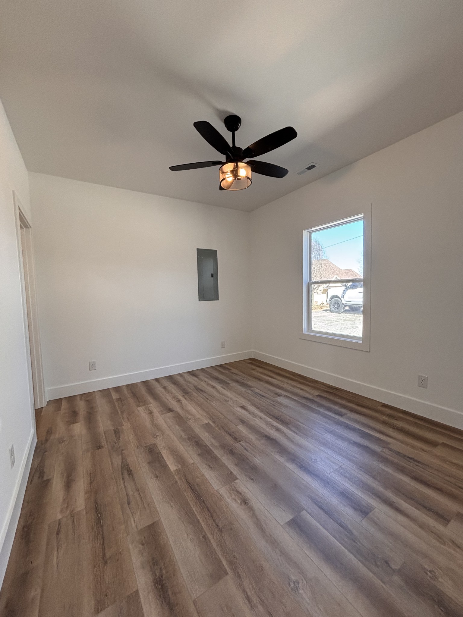 485 Baron Bluff Road Smithville, TN 37166 - Photo 23 of 28 wooden floor in an empty room with a window