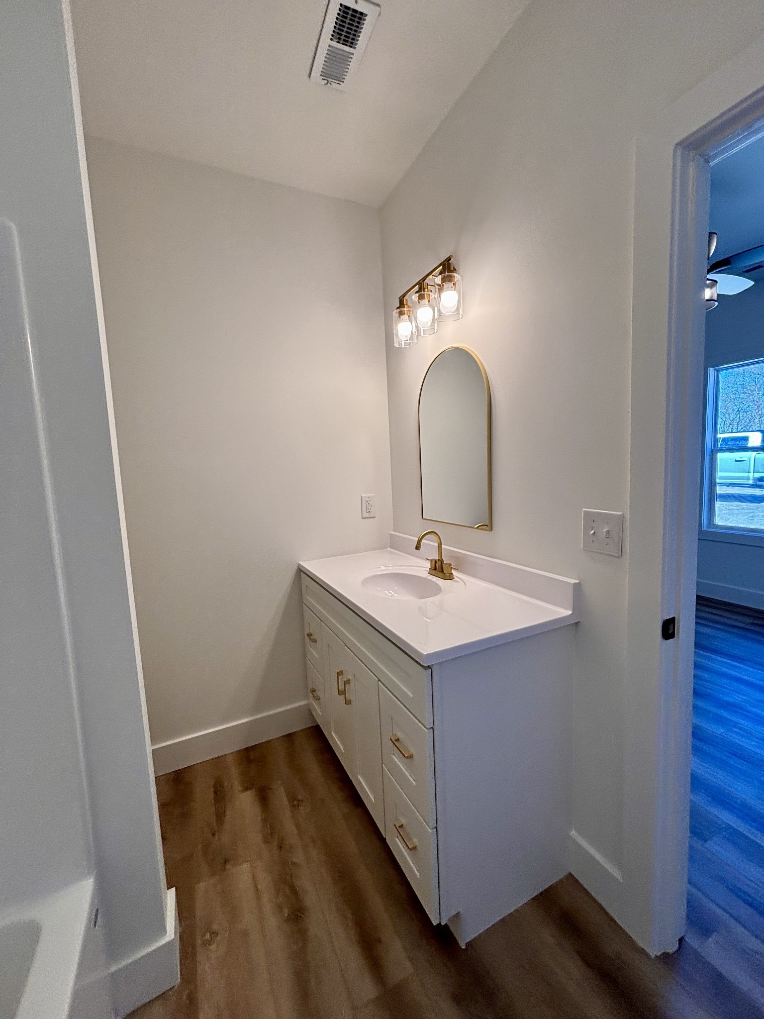 485 Baron Bluff Road Smithville, TN 37166 - Photo 24 of 28 a bathroom with a sink and a mirror