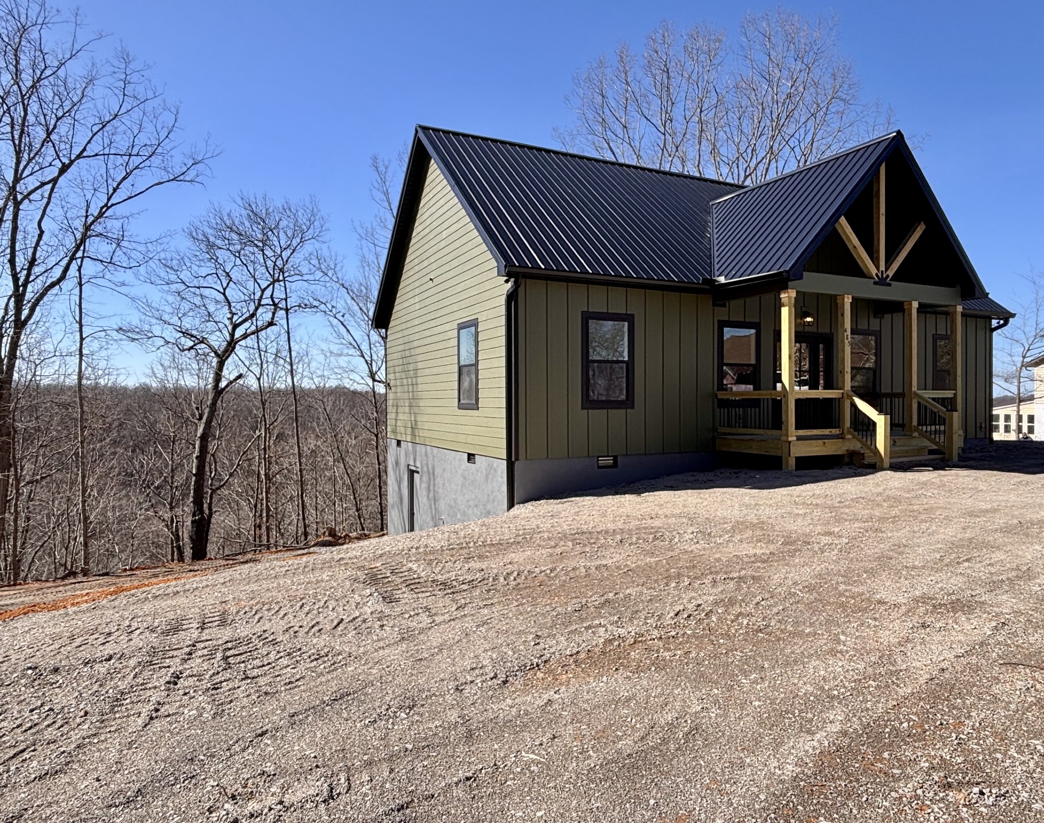 485 Baron Bluff Road Smithville, TN 37166 - Photo 3 of 28 a front view of a house with a yard