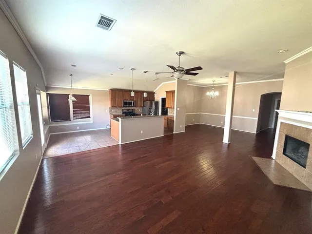 a view of a electric appliances and windows in a room
