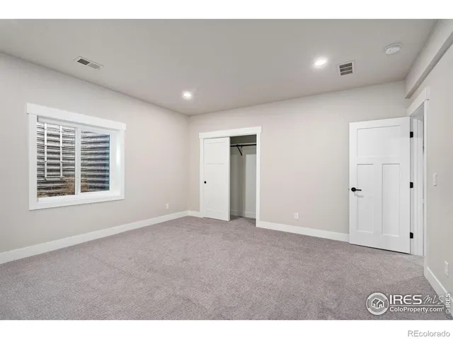 a kitchen with white cabinets