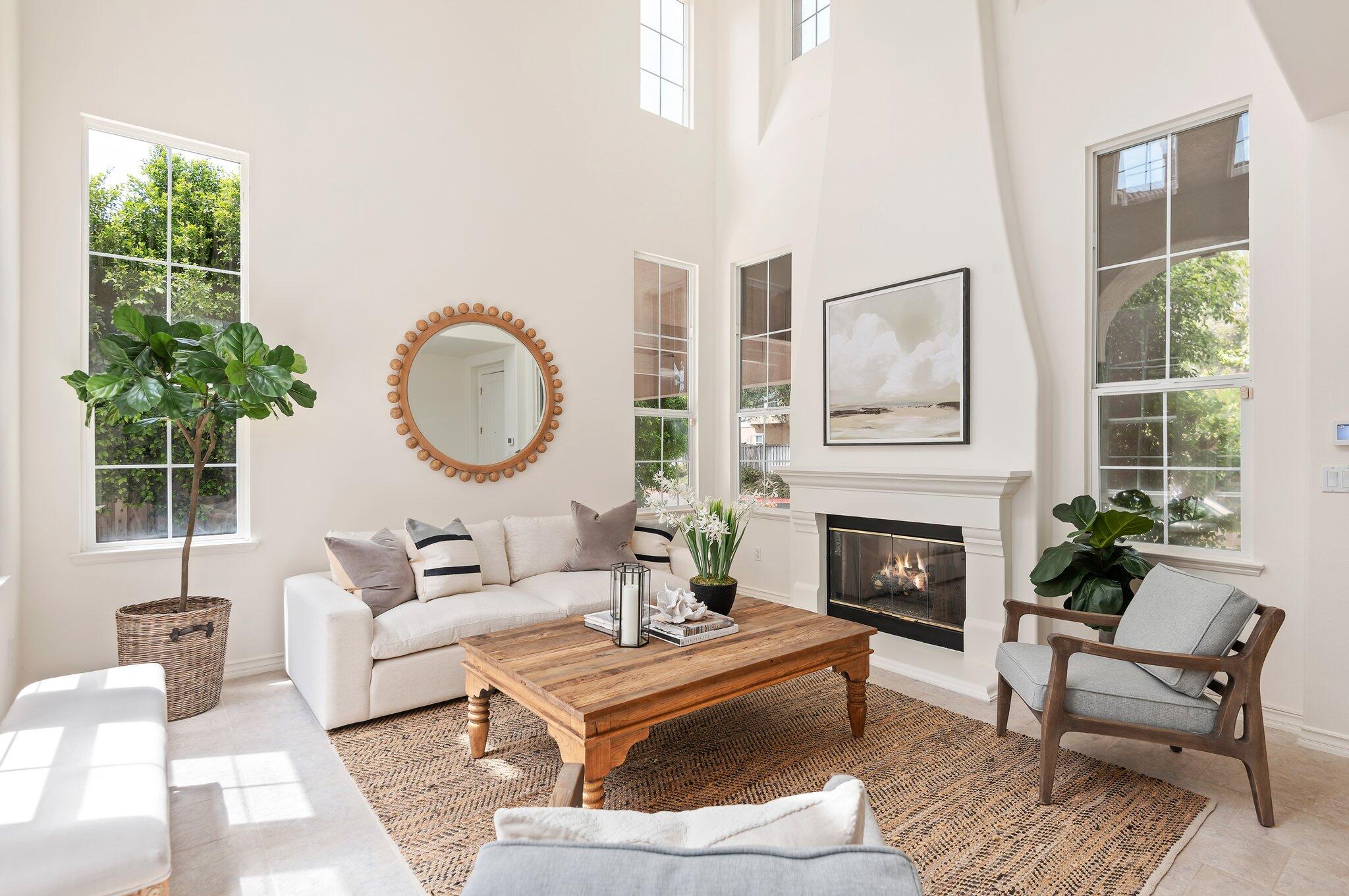 224 King Daniel Lane Goleta, CA 93117 - Photo 1 of 38 a living room with furniture a large window and a fireplace