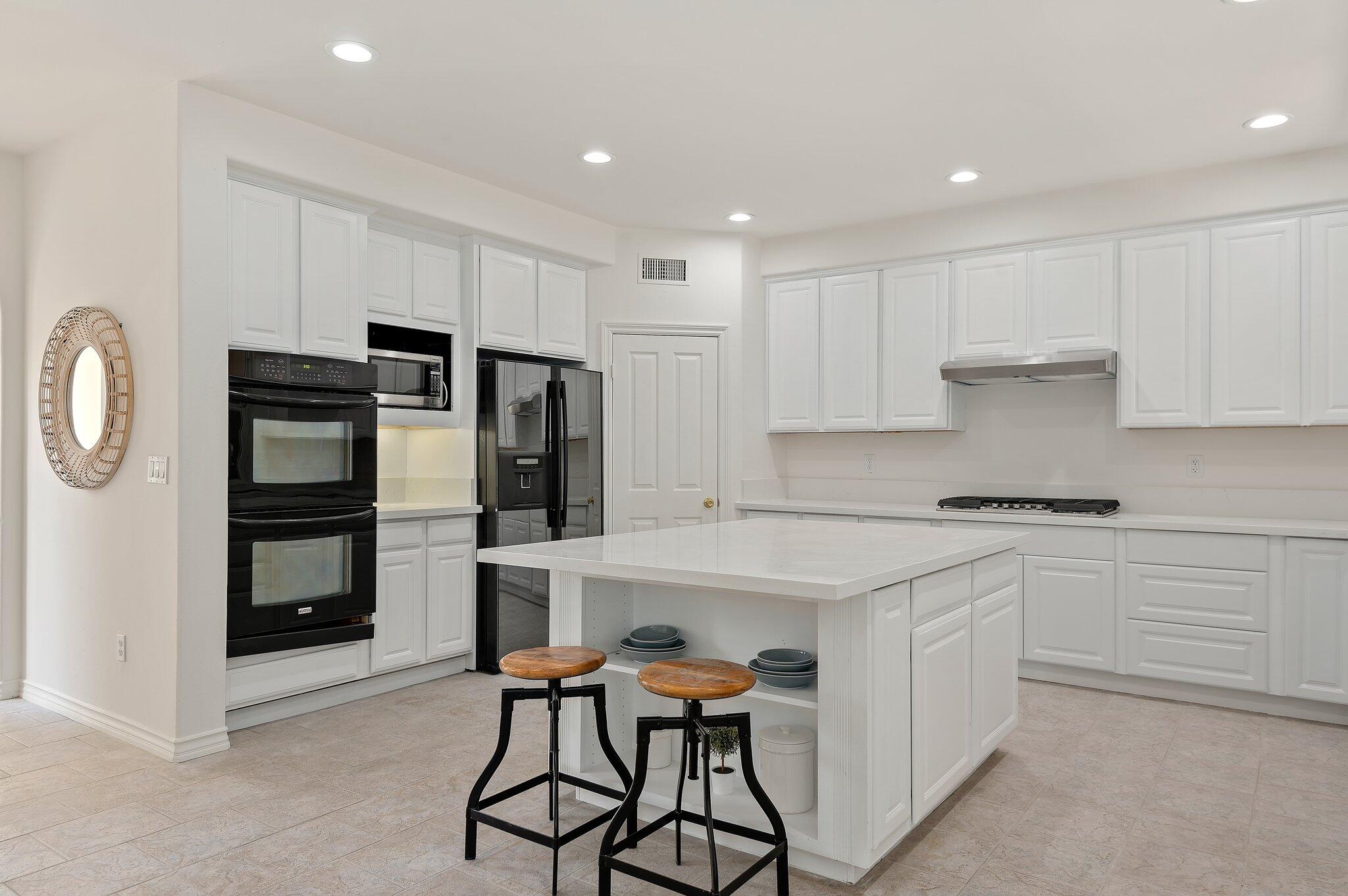 224 King Daniel Lane Goleta, CA 93117 - Photo 11 of 38 a kitchen with stainless steel appliances a refrigerator and a stove top oven