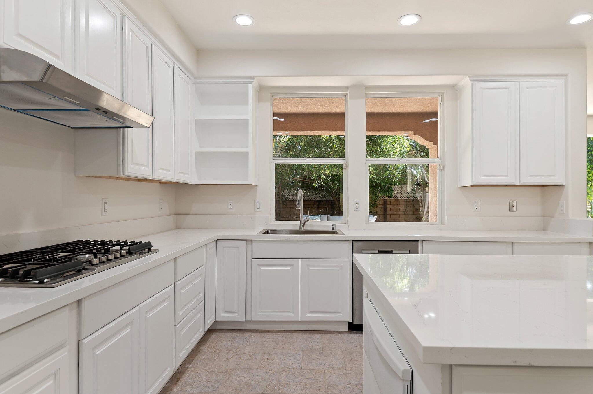 224 King Daniel Lane Goleta, CA 93117 - Photo 12 of 38 a kitchen with cabinets appliances a sink and a window