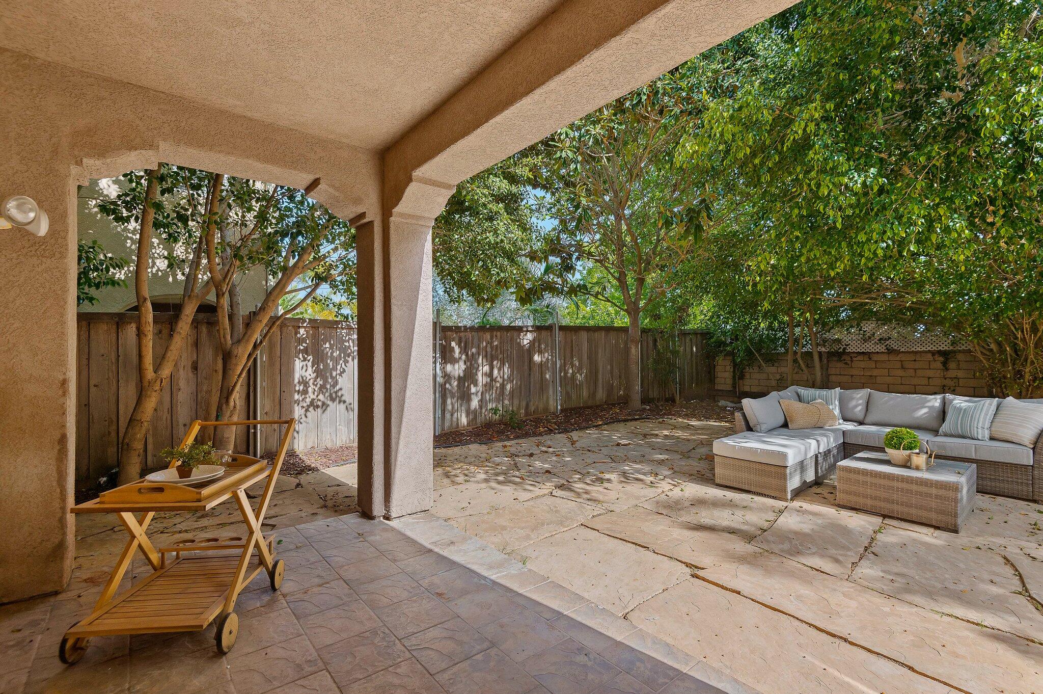 224 King Daniel Lane Goleta, CA 93117 - Photo 16 of 38 a backyard of a house with table and chairs