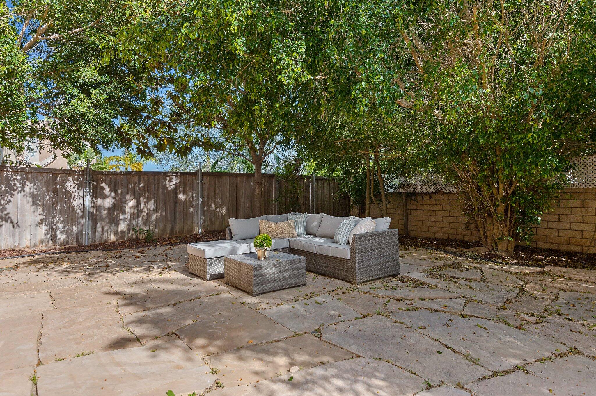 224 King Daniel Lane Goleta, CA 93117 - Photo 17 of 38 a view of backyard with outdoor seating and trees