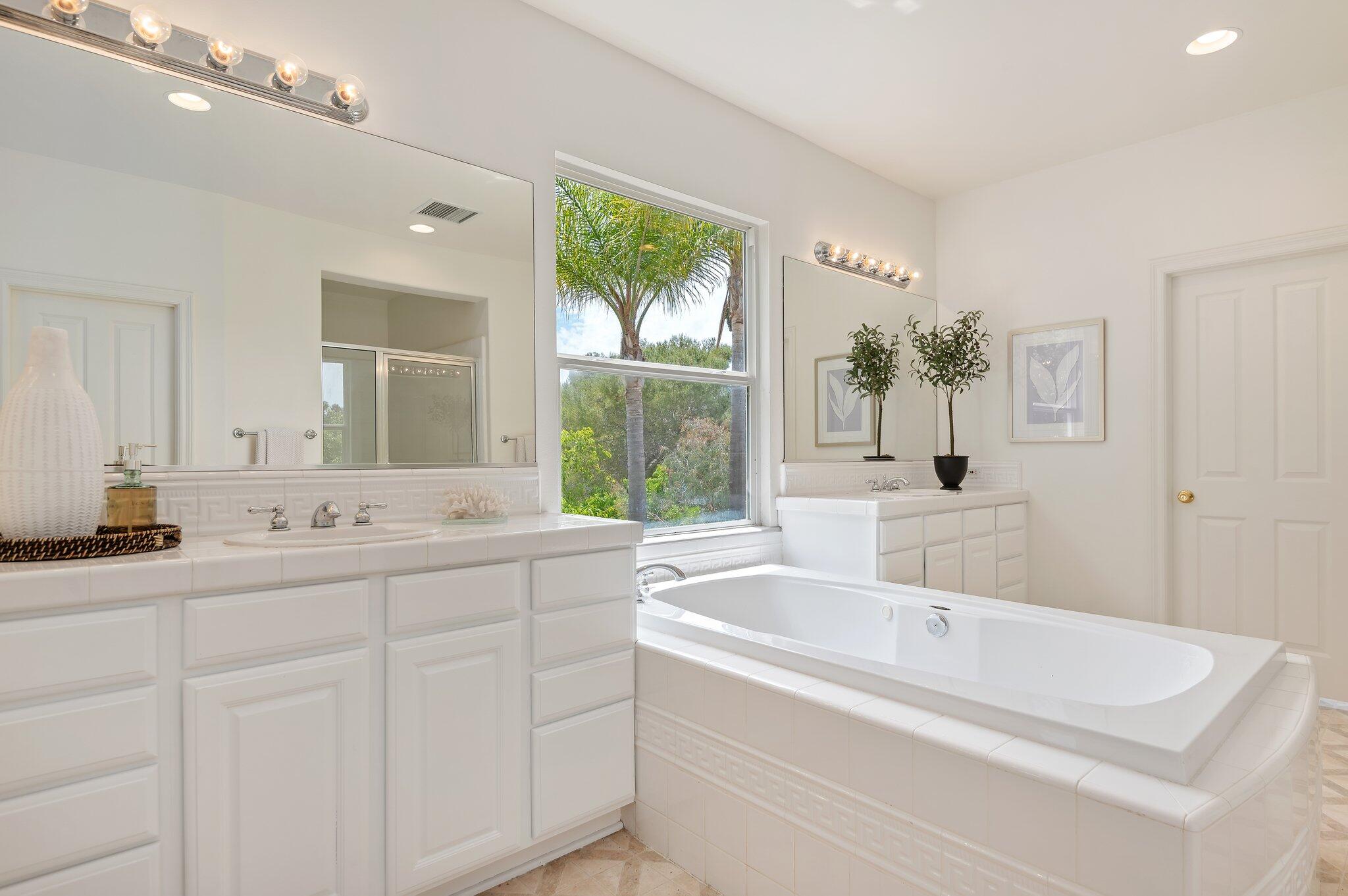 224 King Daniel Lane Goleta, CA 93117 - Photo 27 of 38 a bathroom with a tub sink and mirror