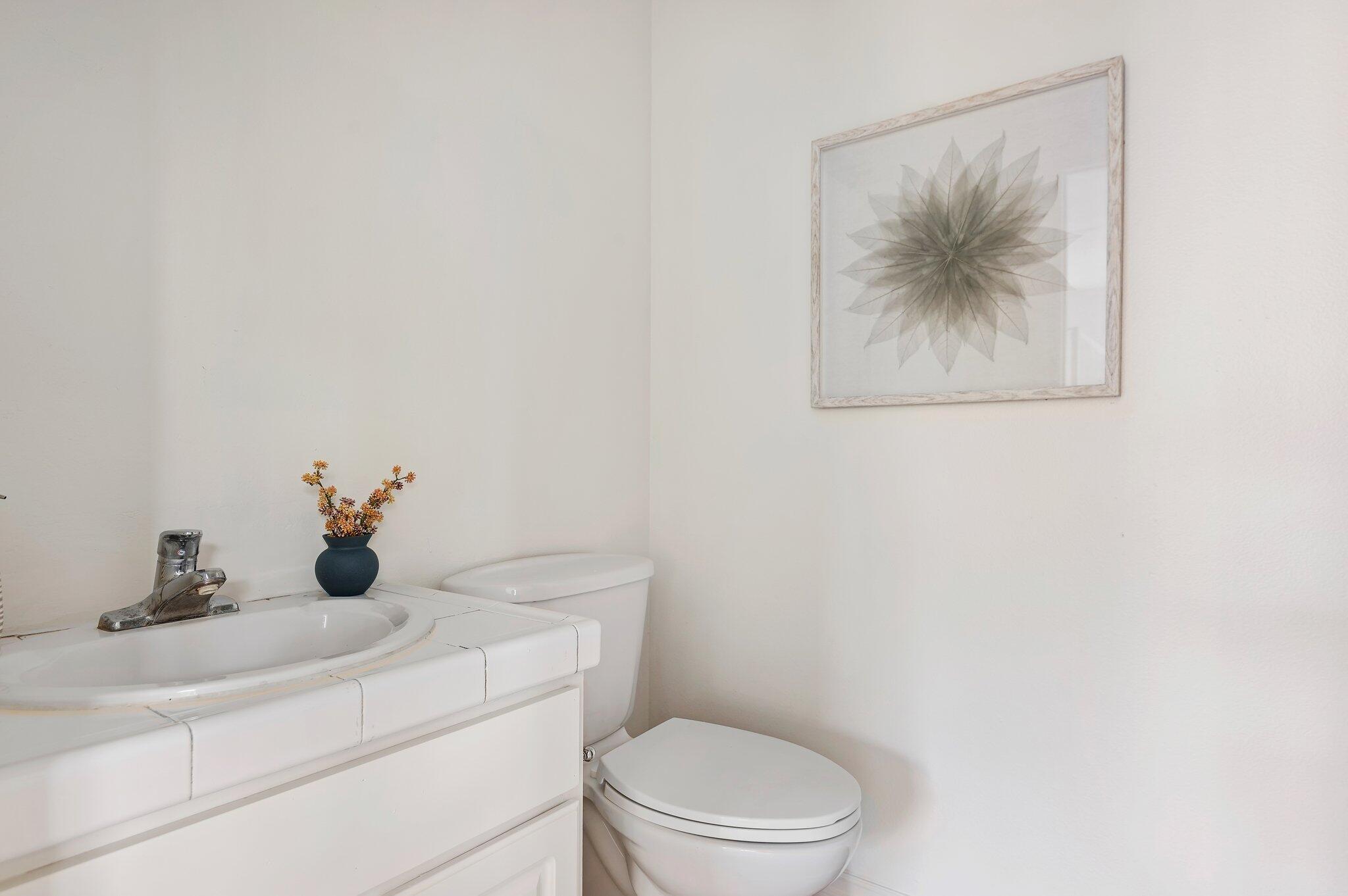 224 King Daniel Lane Goleta, CA 93117 - Photo 35 of 38 a bathroom with a toilet a sink and mirror