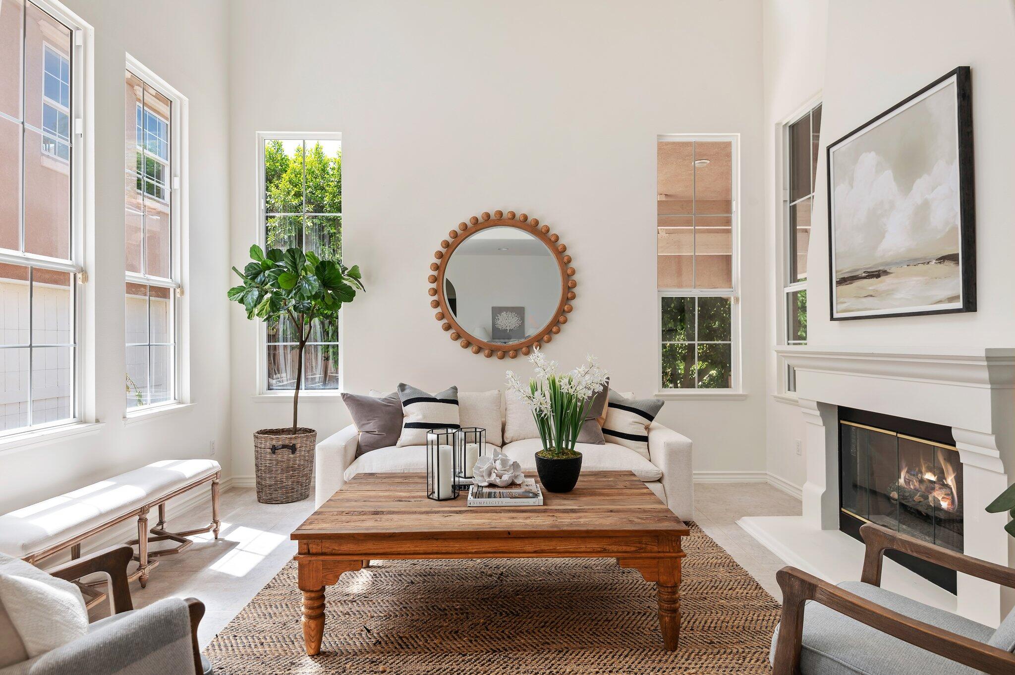 224 King Daniel Lane Goleta, CA 93117 - Photo 5 of 38 a living room with furniture a potted plant and a fireplace