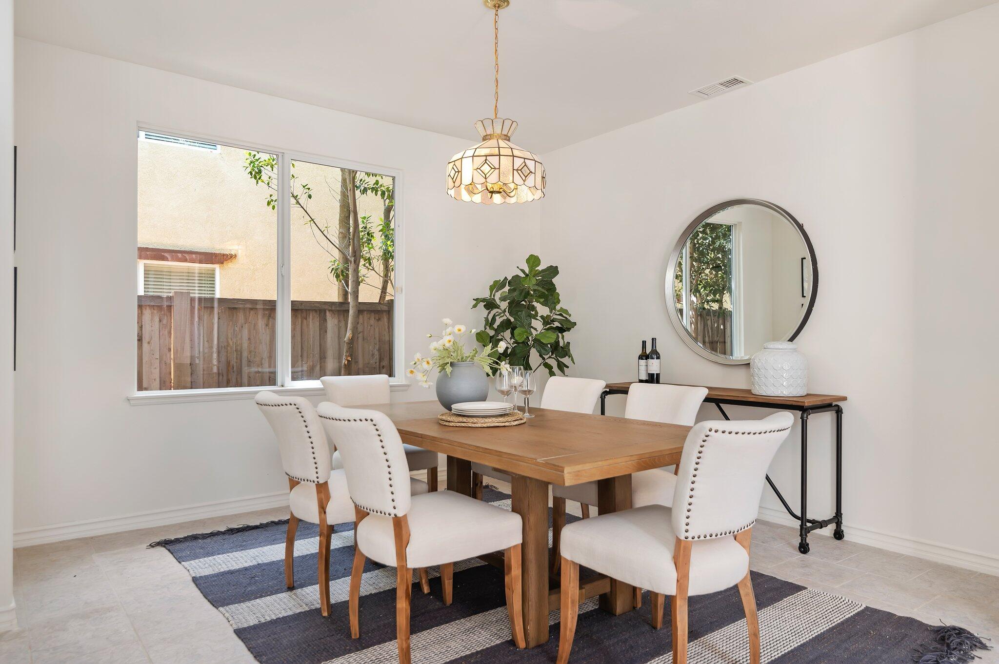 224 King Daniel Lane Goleta, CA 93117 - Photo 7 of 38 a view of a dining room with furniture window and wooden floor