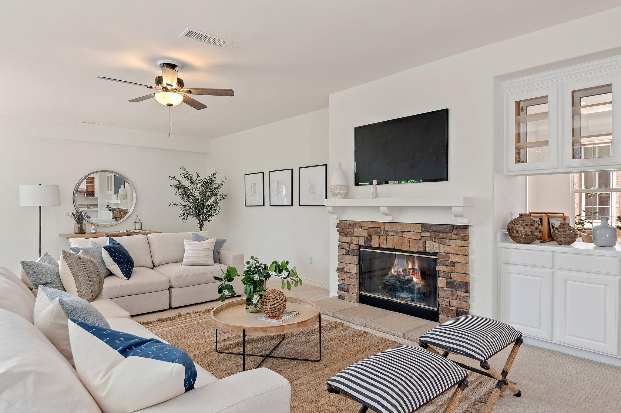 224 King Daniel Lane Goleta, CA 93117 - Photo 8 of 38 a living room with furniture a flat screen tv and a fireplace