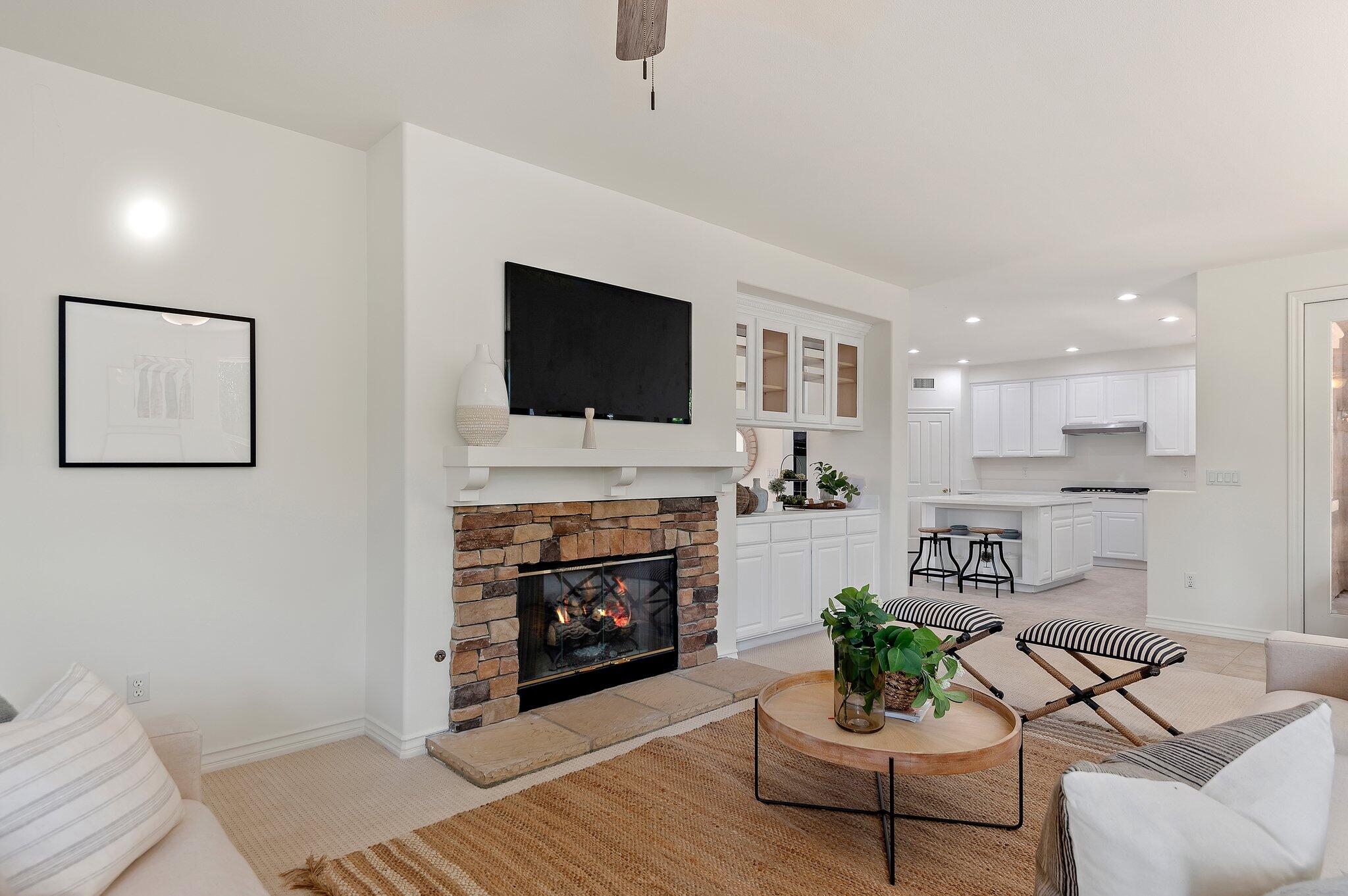 224 King Daniel Lane Goleta, CA 93117 - Photo 10 of 38 a living room with furniture a fireplace and a flat screen tv