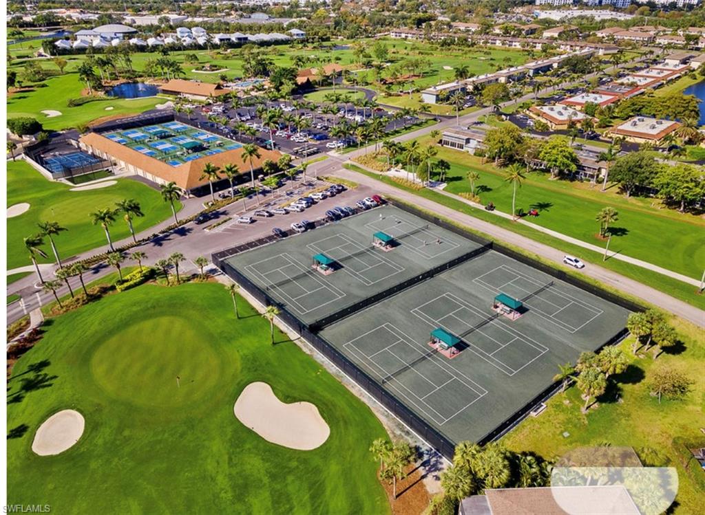 197 Harrison Road, Unit 3 Naples, FL 34112 - Photo 13 of 14 Bird's eye view of a golf course and a large body of water