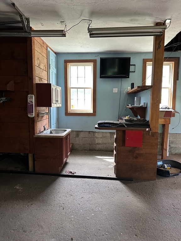 80 Phillips Street Hanson, MA 02341 - Photo 8 of 9 a living room with furniture and a flat screen tv