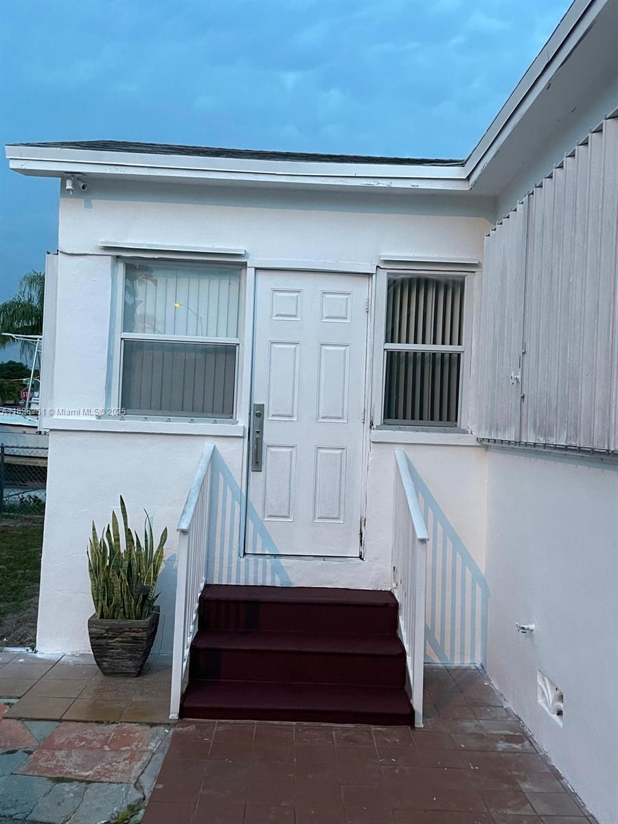 217 East 20th Street Hialeah, FL 33010 - Photo 11 of 22 a view of front door of house
