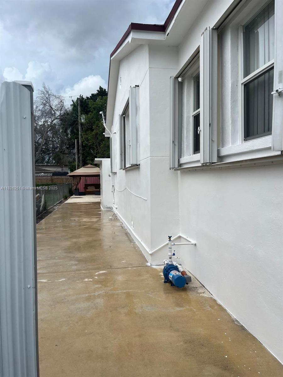 217 East 20th Street Hialeah, FL 33010 - Photo 12 of 22 a view of a house with backyard and sitting area
