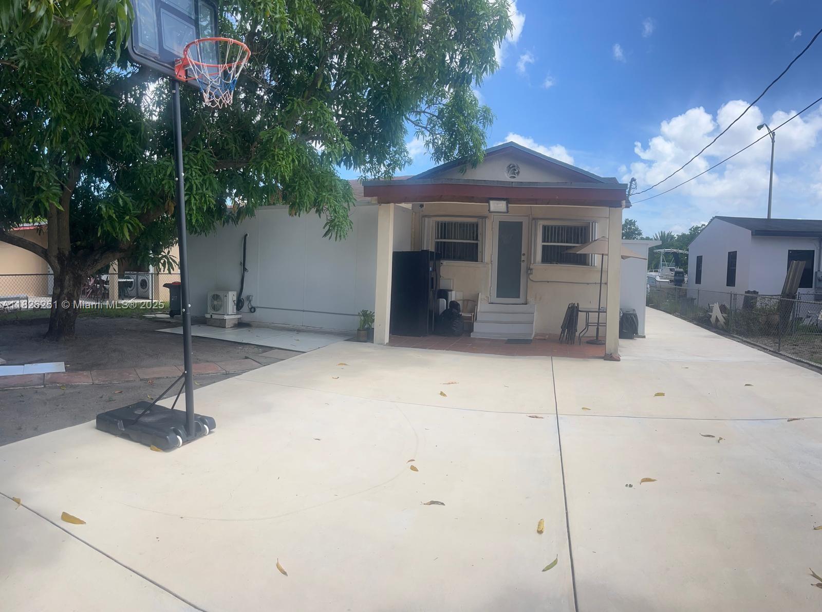 217 East 20th Street Hialeah, FL 33010 - Photo 14 of 22 a front view of a house with garden