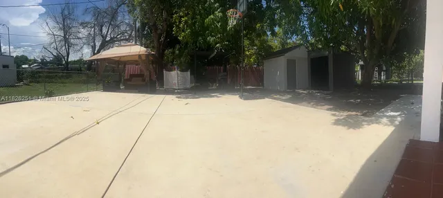a backyard of a house with lots of green space