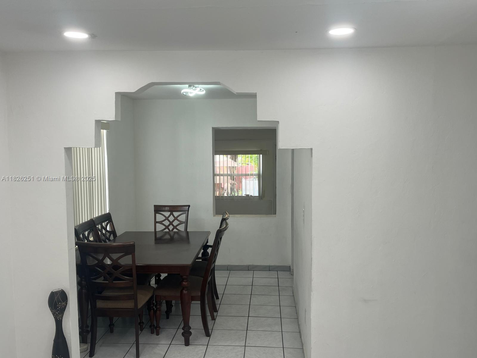 217 East 20th Street Hialeah, FL 33010 - Photo 3 of 22 a view of a dining room with furniture and wooden floor