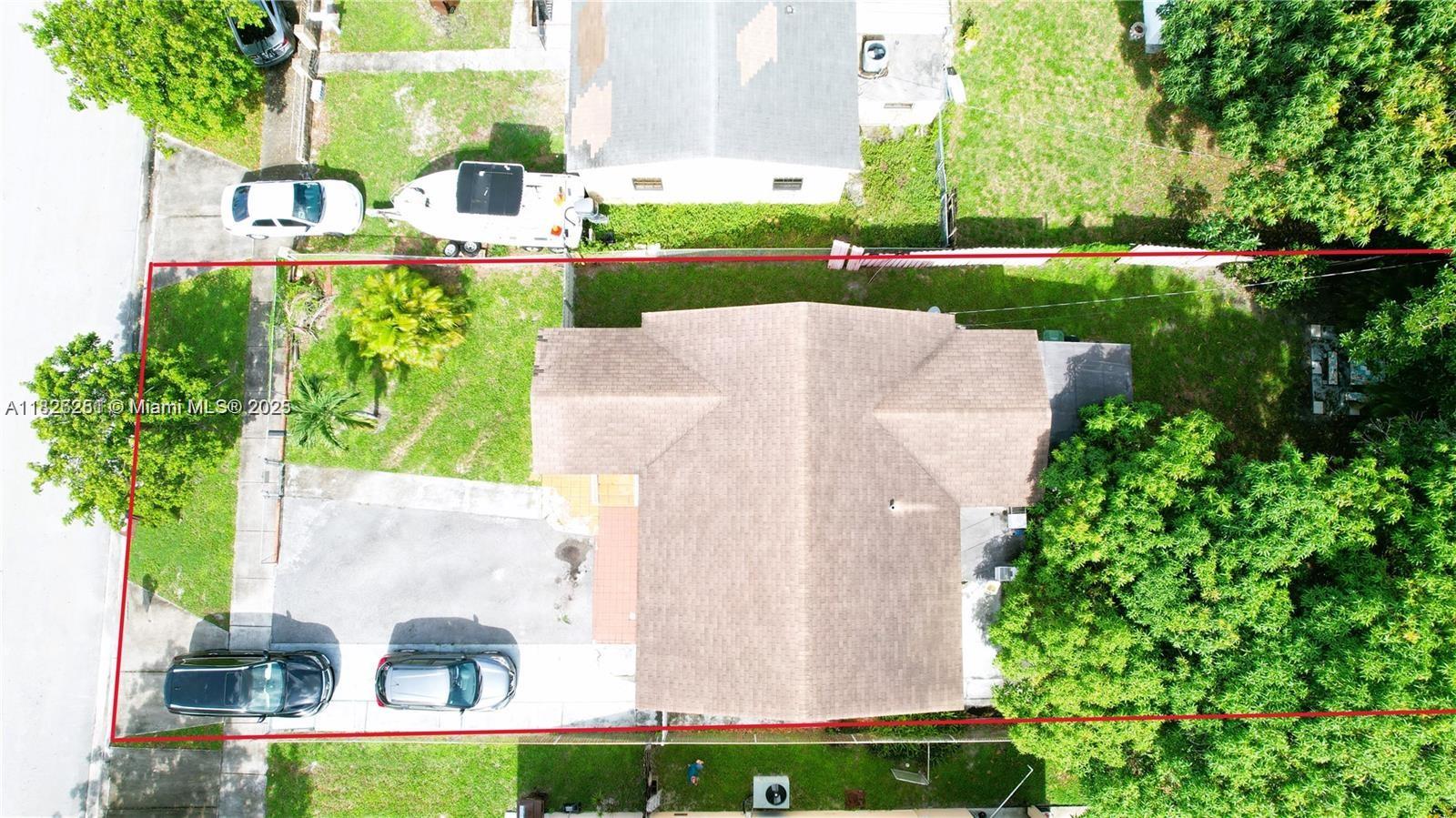 217 East 20th Street Hialeah, FL 33010 - Photo 9 of 22 a view of backyard with outdoor seating and green space