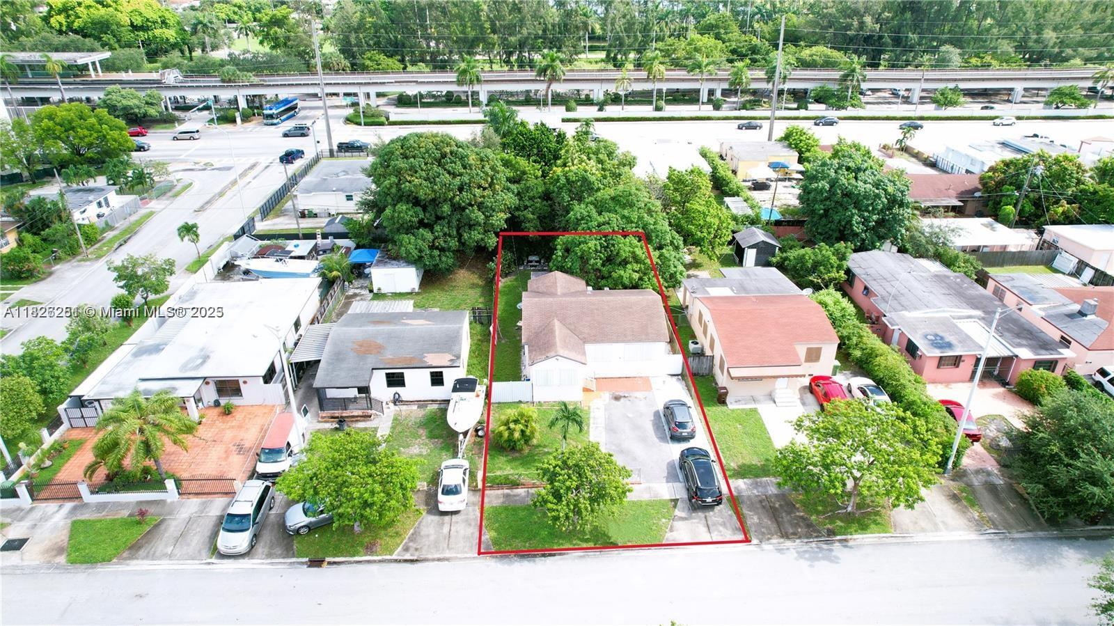 217 East 20th Street Hialeah, FL 33010 - Photo 10 of 22 an aerial view of a house with a yard basket ball court and outdoor seating