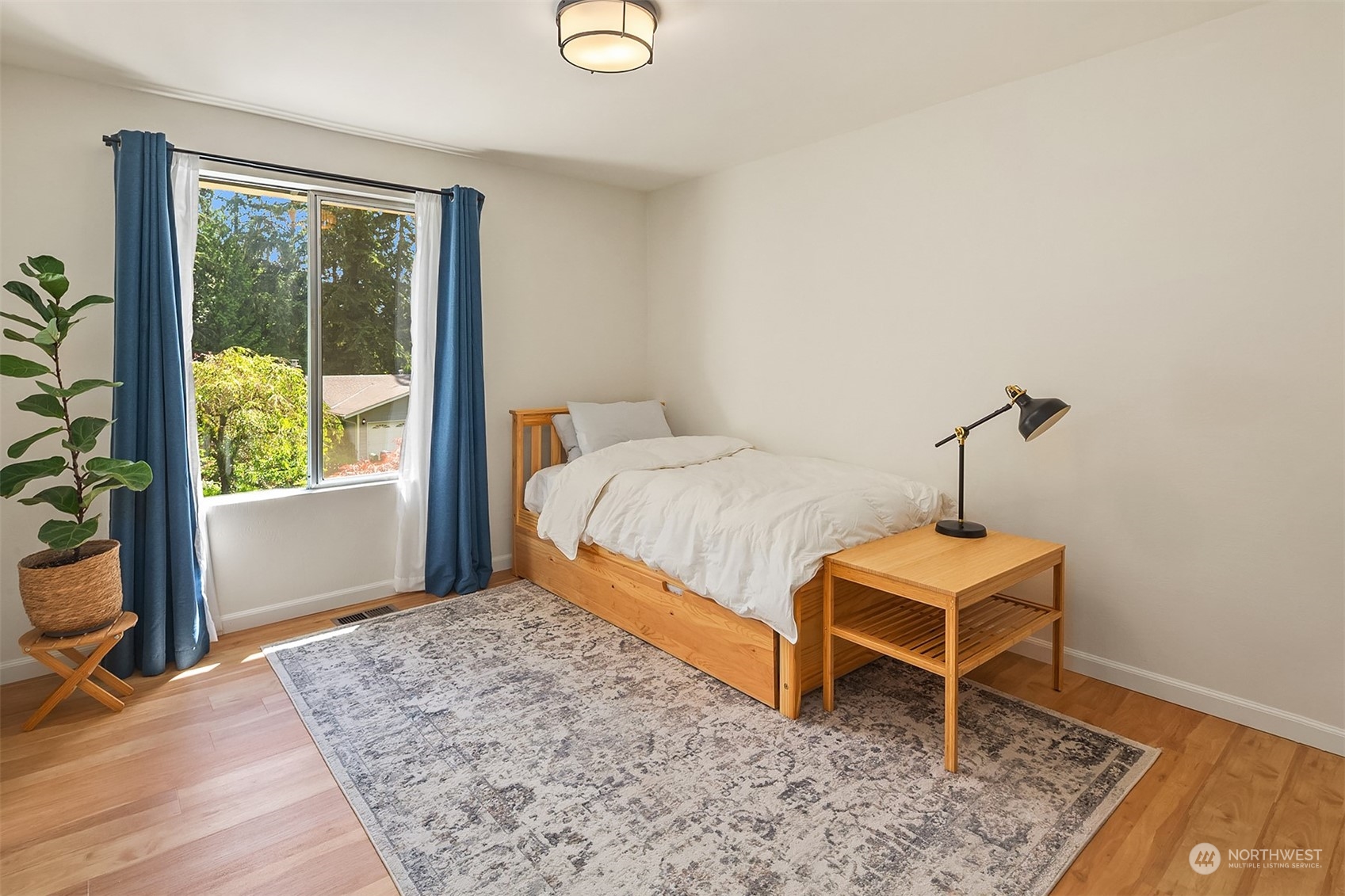 21322 2nd Drive Southeast Bothell, WA 98021 - Photo 16 of 29 a bedroom with a bed and a window