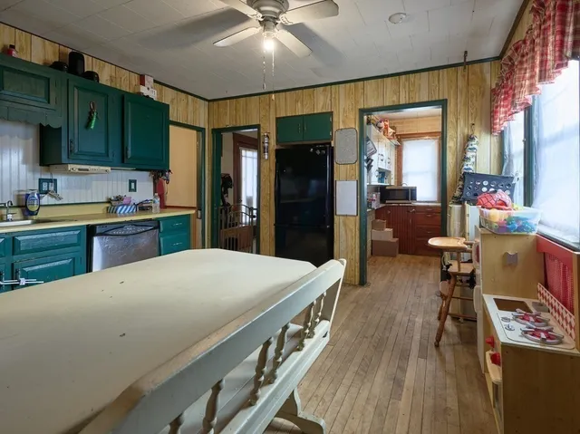 a kitchen with stainless steel appliances a stove a refrigerator sink and cabinets
