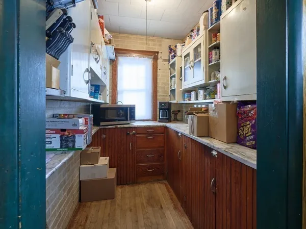 a kitchen with stainless steel appliances granite countertop a refrigerator a stove and a wooden cabinets