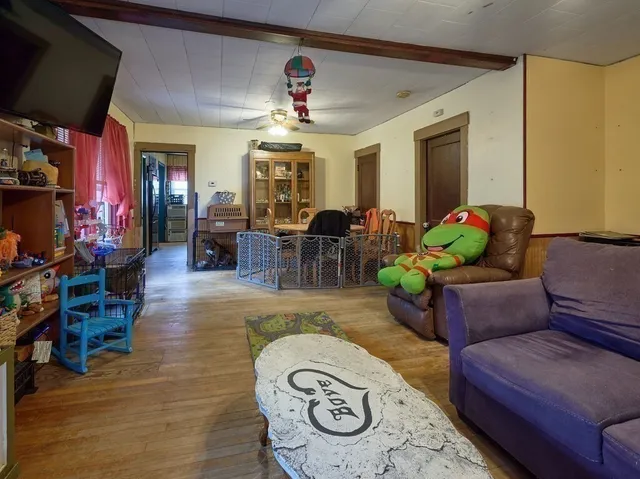 a living room with furniture and a chandelier